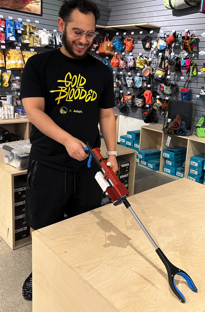 Serag's smart litter grabber prototype — full view including the sensor unit mounted on the grabber shaft